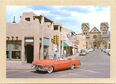 The red convertible, driven by Dean Martin, makes a turn onto one of the streets bordering the historic Santa Fe Plaza. Martin, makes a turn onto one of the streets bordering the historic Santa Fe Plaza.