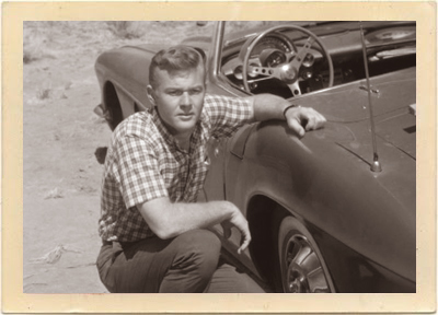 Tod Stiles (Martin Milner) examines the extent of the damage to his Corvette in a scene from Episode 26 of “Route 66,” entitled “A Skill for Hunting.”